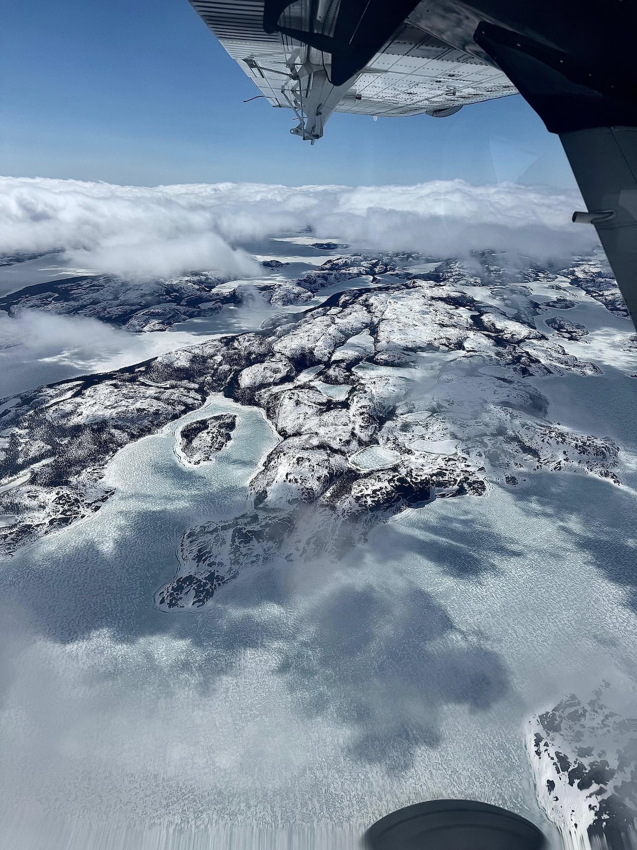 Snowy mountain view from a plane.