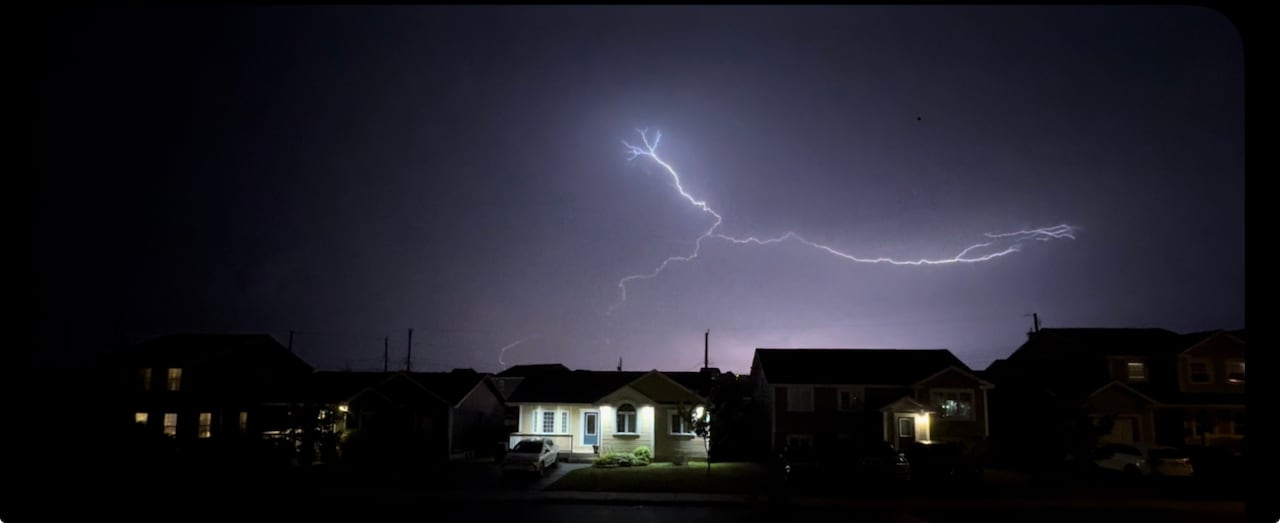 Fork of lightning over houses
