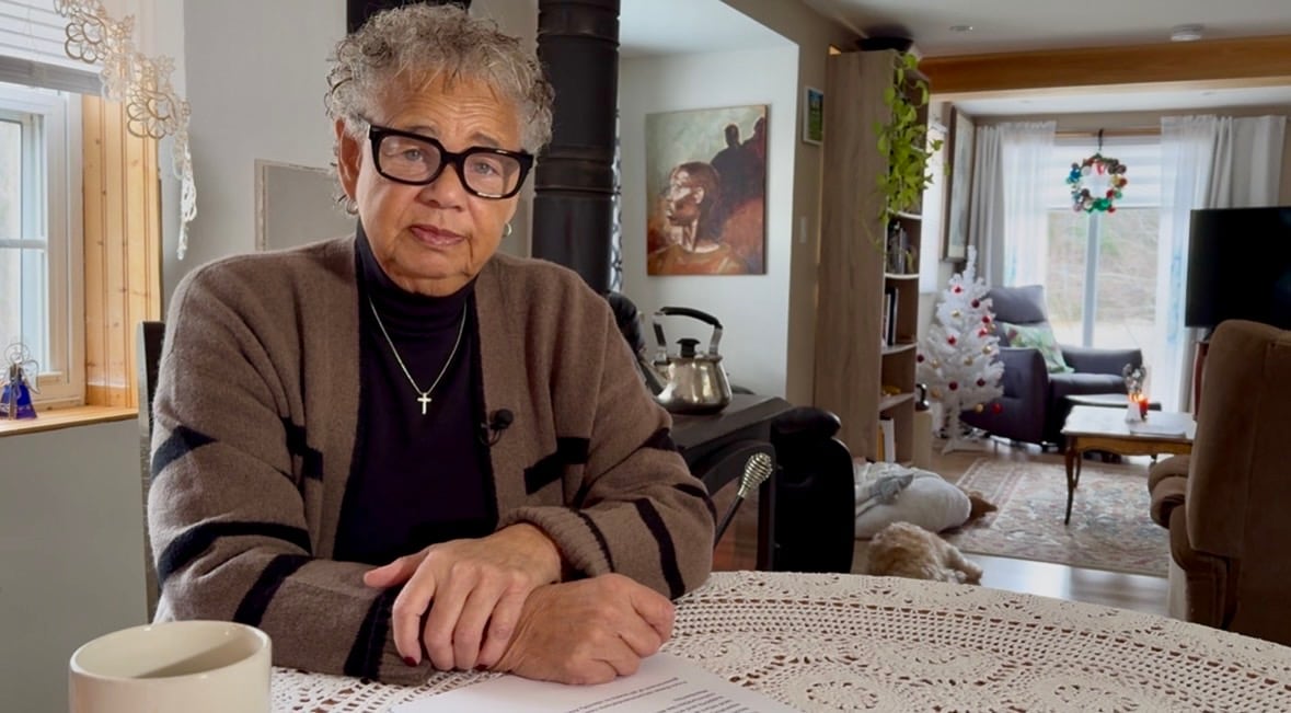 African Nova Scotia woman sitting at her kitchen table