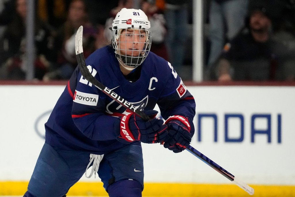 FILE - United States forward Hilary Knight skates to the bench to celebrate her goal against Canada during the first period of a rivalry series women