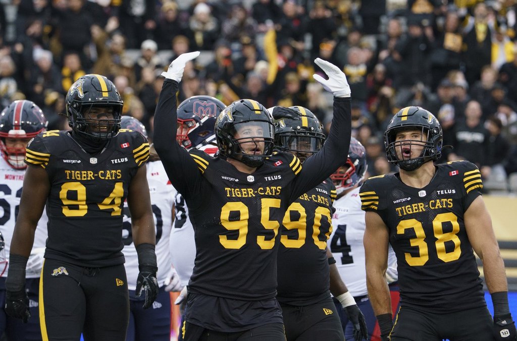 Hamilton Tiger-Cats defensive lineman Julian Howsare (95) tries to get the crowd going during first half CFL East Final football action against the Montreal Alouettes, in Hamilton on Saturday, Nov. 8, 2025. The Ticats earned top marks in the CFL Players