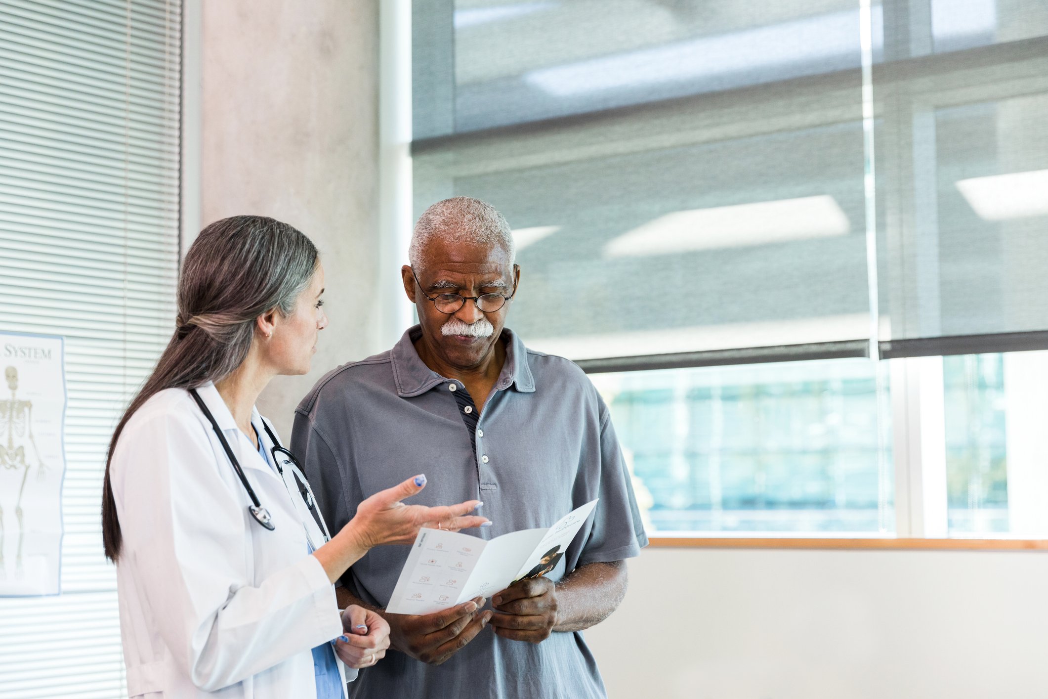 Physician and patient discussing the patient's healthcare plan.