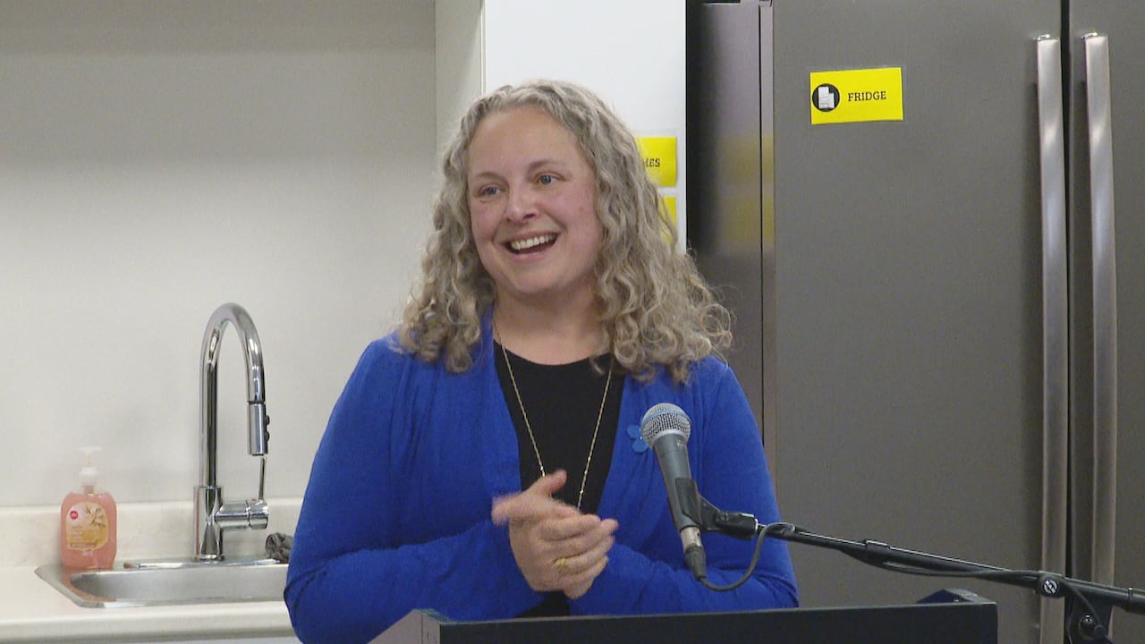 A woman poses for a photo