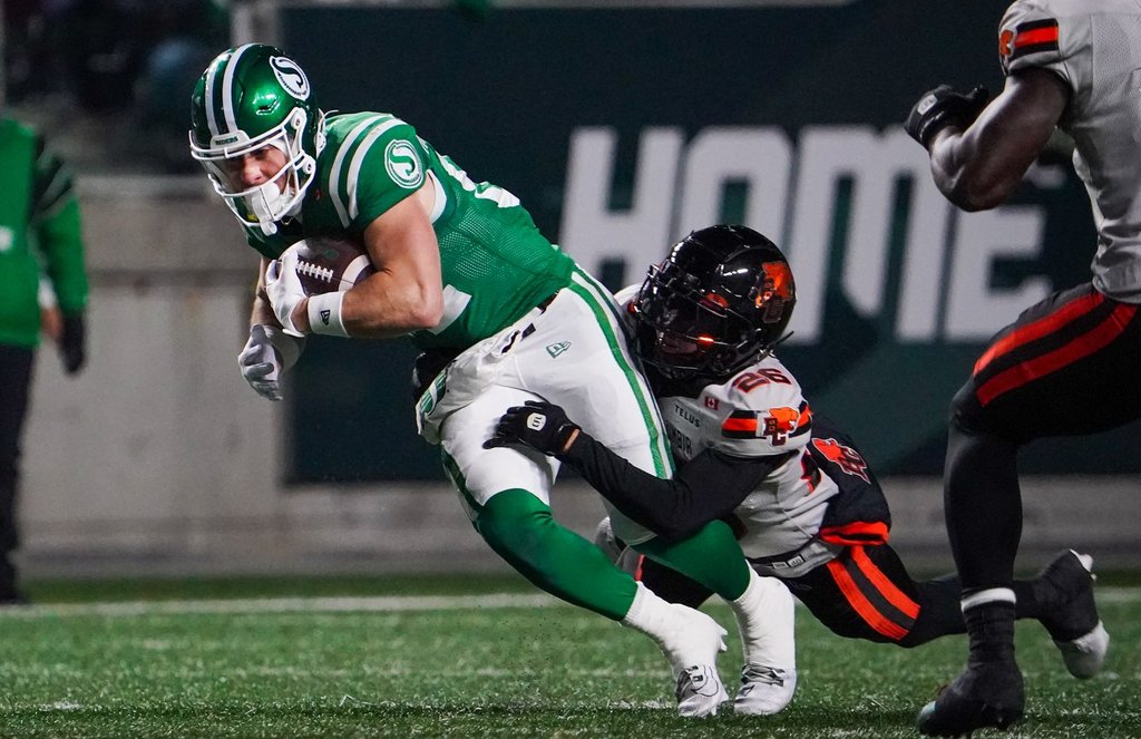 B.C. Lions defensive back Robert Carter Jr. (26) tackles Saskatchewan Roughriders receiver Joe Robustelli (82) during the first half of CFL West Division Final football action in Regina, on Saturday, November 8, 2025. THE CANADIAN PRESS/Heywood Yu