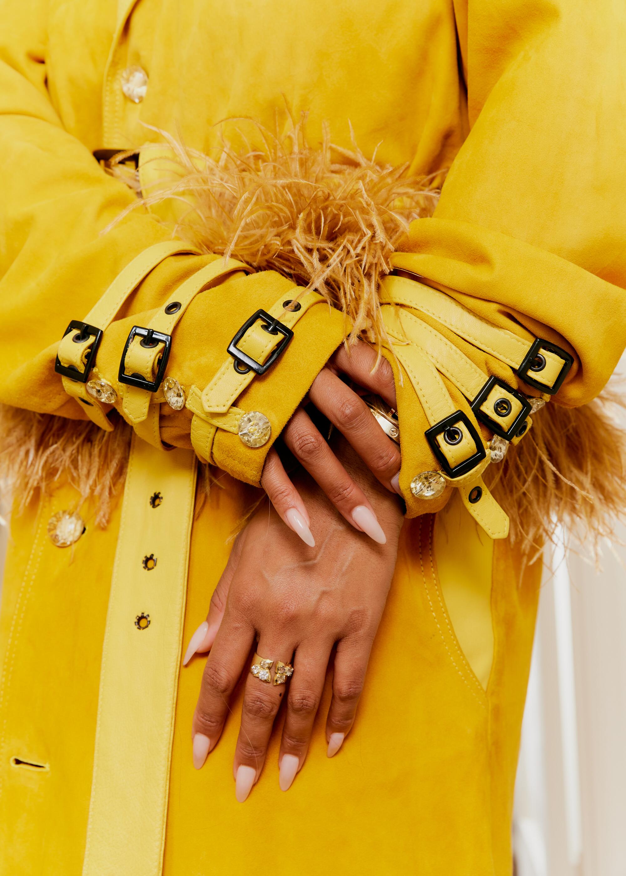 Stylist Brittany Hampton. Detail of cuff on trenchcoat.