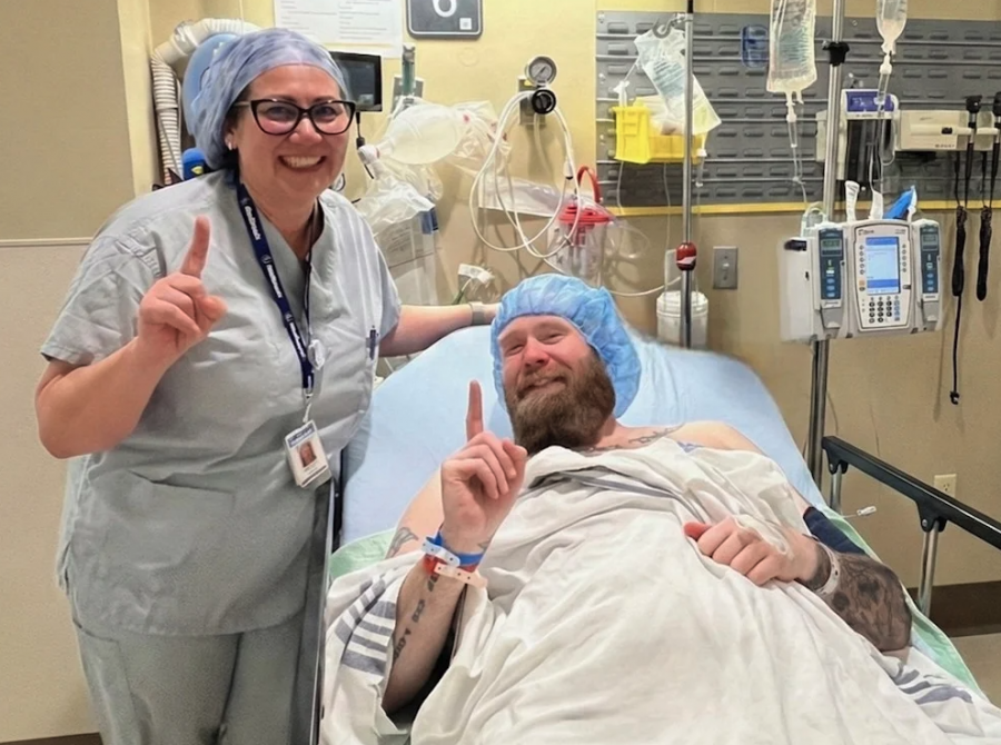 <who> Photo credit: The Tyee/LJI </who> Sean Forsberg was the first Canadian to get a closed-loop spinal cord stimulator. Mariko Taylor from manufacturer Medtronic poses beside him.