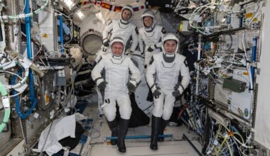 This photo provided by NASA shows clockwise from bottom left are, NASA astronaut Mike Fincke, Roscosmos cosmonaut Oleg Platonov, NASA astronaut Zena Cardman, and JAXA (Japan Aerospace Exploration Agency) astronaut Kimiya Yui gathering for a crew portrait wearing their Dragon pressure suits during a suit verification check inside the International Space Station’s Kibo laboratory module, Wednesday, Jan. 14, 2026. (NASA via AP)
