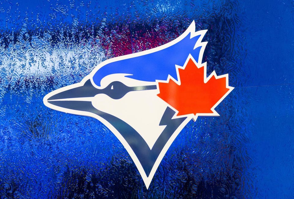 Logo of the Toronto Blue Jays baseball team on a blue...