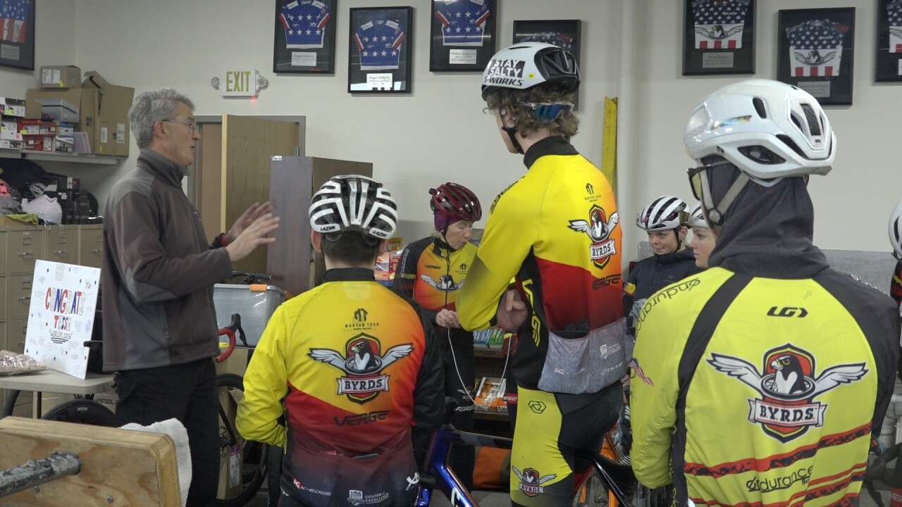 Douglas Tobin talks with some riders before training