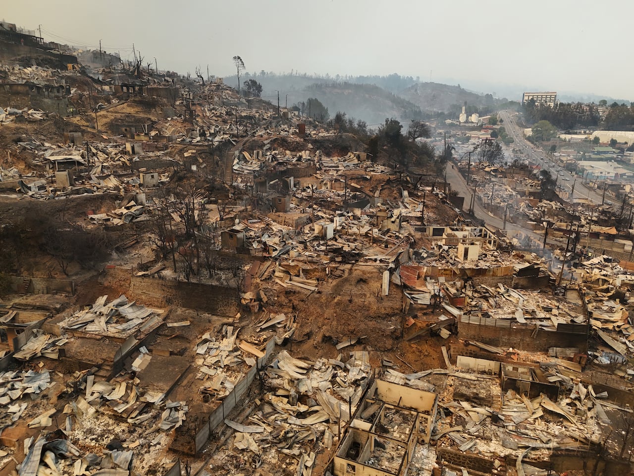 An aerial view shows homes destroyed by fire.