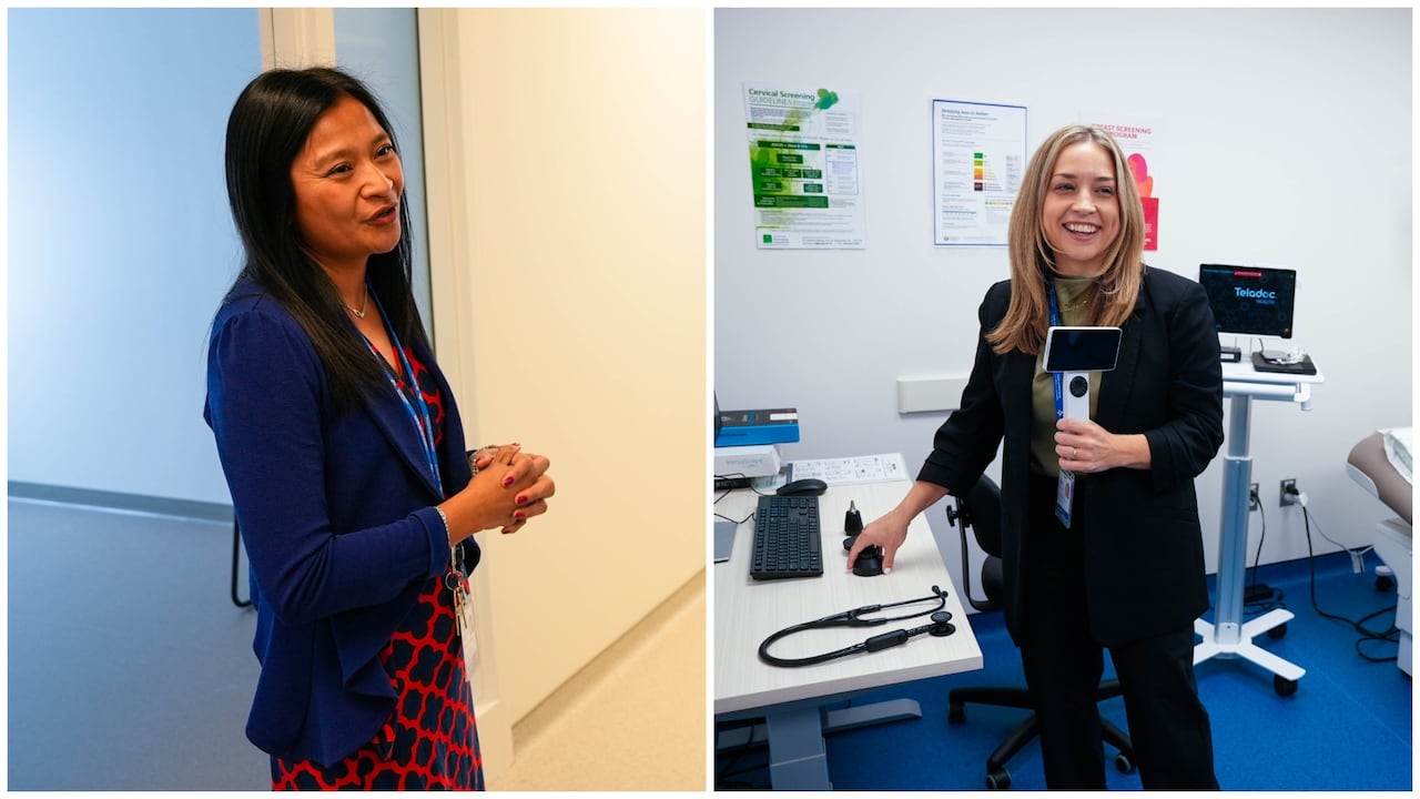 Two women stand inside a medical care facility.