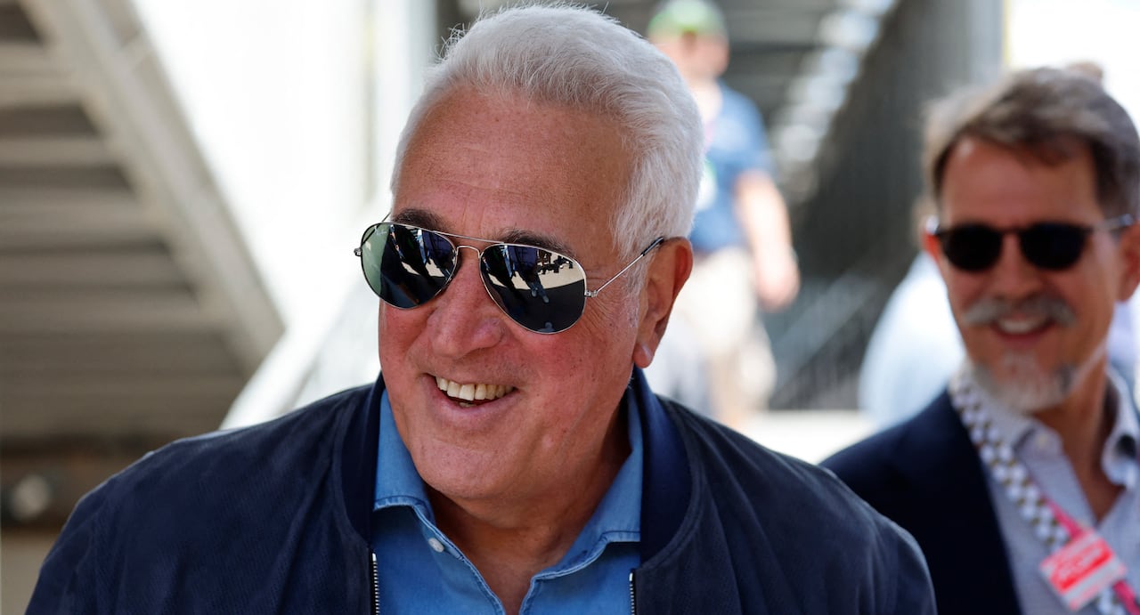 A white haired man in sunglasses smiling
