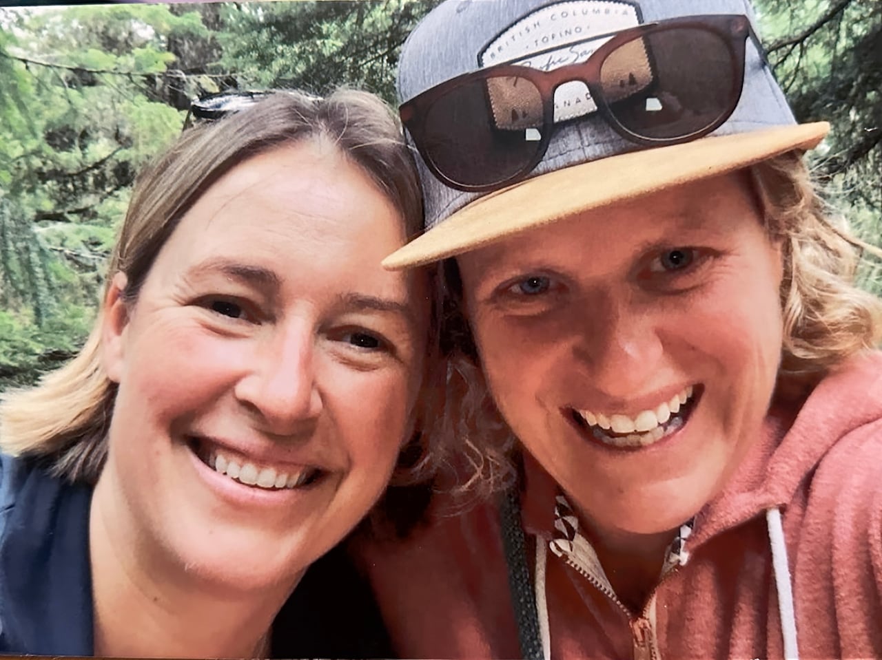 Two white women smile in a selfie.