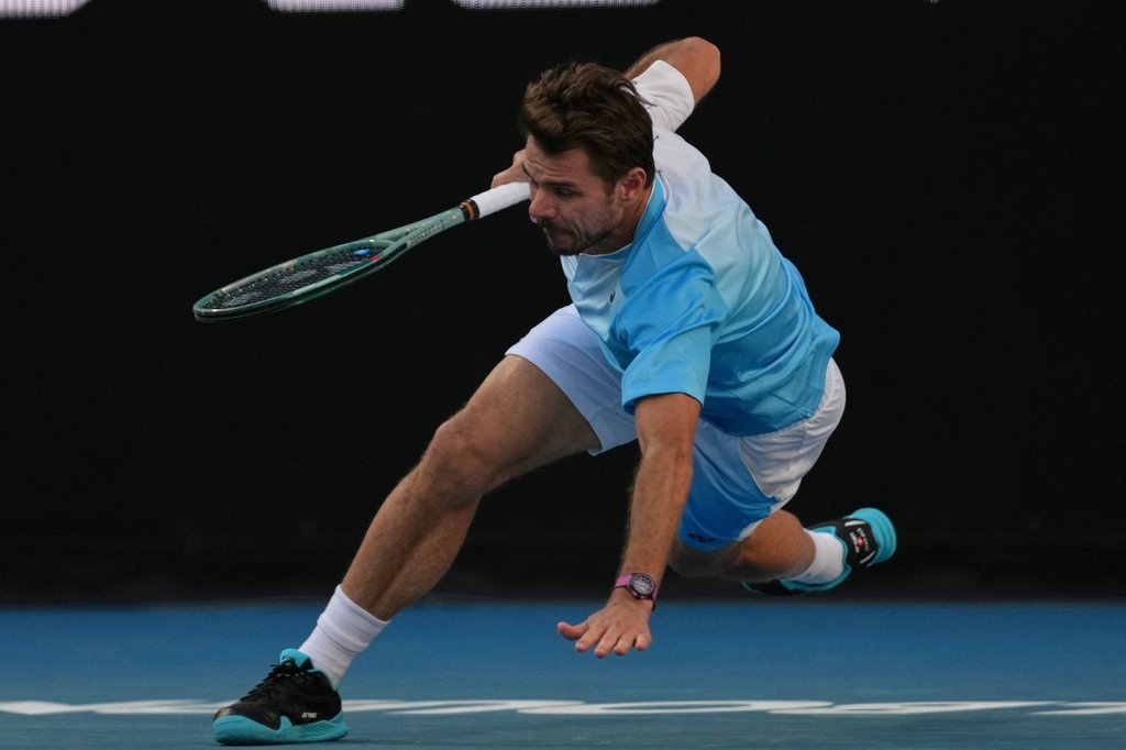 Stan Wawrinka of Switzerland falls during his second round match against Arthur Gea of France at the Australian Open tennis championship in Melbourne, Australia, Thursday, Jan. 22, 2026. (AP Photo/Dita Alangkara)