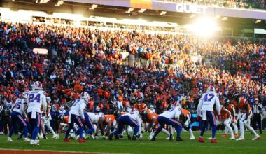 The sun reflects on a window as played line up during the second half of an NFL divisional round playoff football game between the Buffalo Bills and the Denver Broncos, Saturday, Jan. 17, 2026, in Denver. (AP Photo/Jack Dempsey)