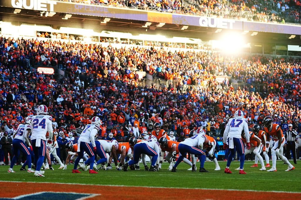 The sun reflects on a window as played line up during the second half of an NFL divisional round playoff football game between the Buffalo Bills and the Denver Broncos, Saturday, Jan. 17, 2026, in Denver. (AP Photo/Jack Dempsey)