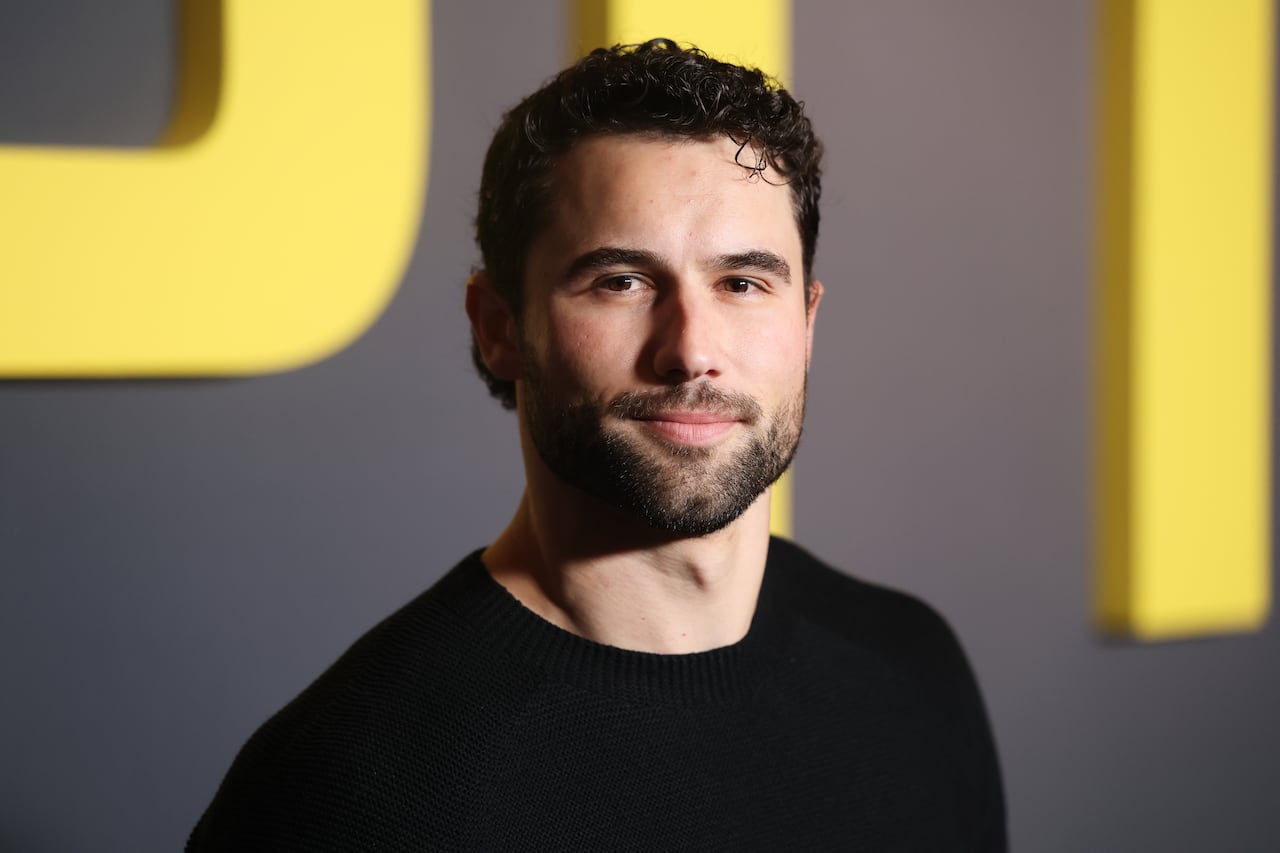 Man wears black shirt.