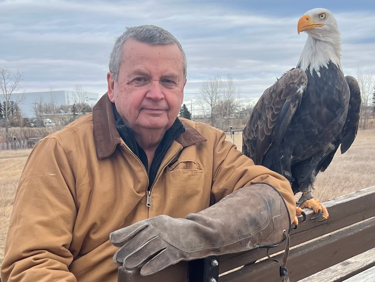 A man with a bald eagle.