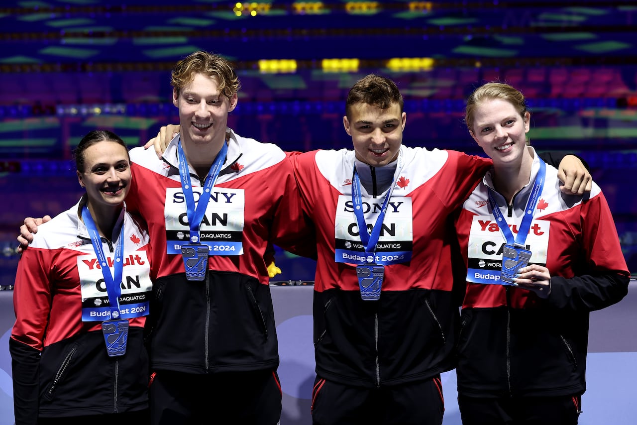 Four swimmers after a race.