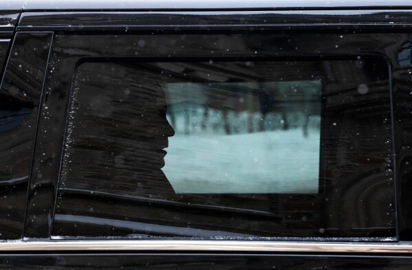 Canadian Prime Minister Mark Carney arrives by motorcade to Parliament Hill in Ottawa, Tuesday, Jan. 27, 2026. (Adrian Wyld/The Canadian Press via AP)