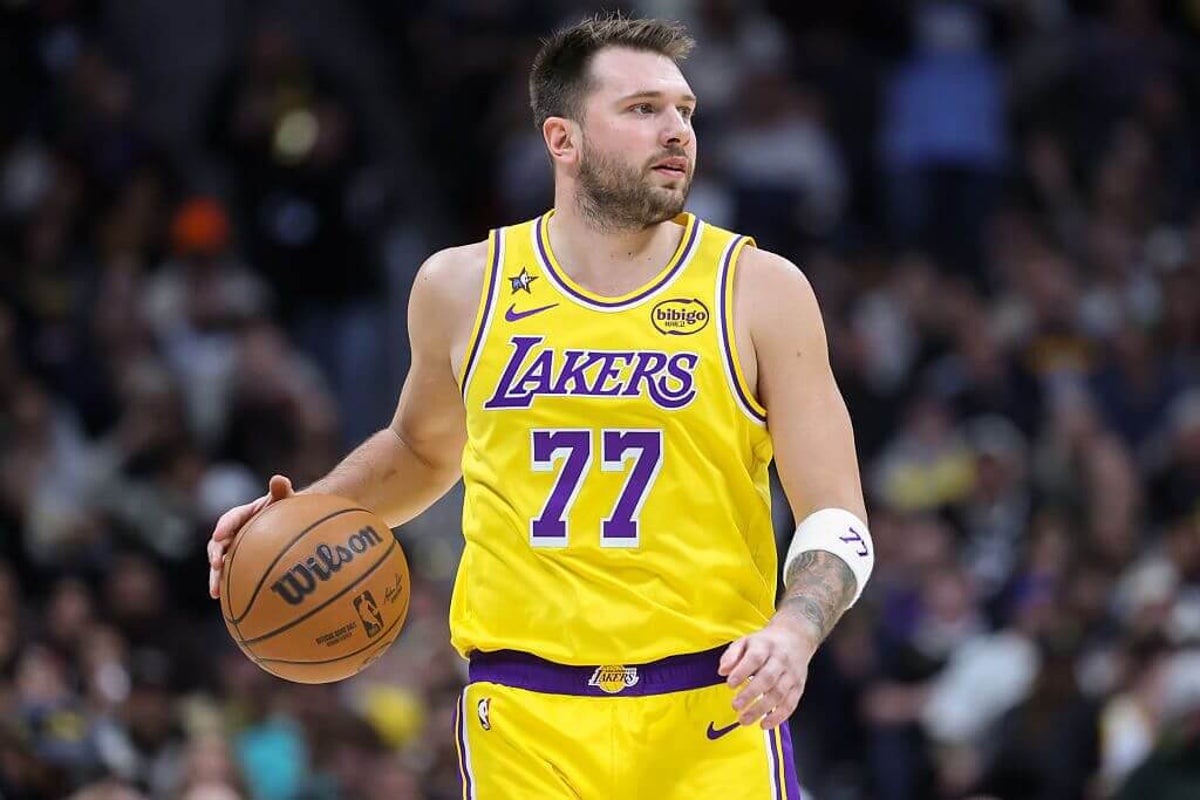 Lakers’ Luka Dončić injures left leg after awkward step off Cavs’ elevated court