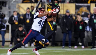 Montreal Alouettes defensive back Kabion Ento (48) breaks up a pass to Hamilton Tiger-Cats wide receiver Tim White (12) during second half CFL eastern final football action in Hamilton, Ont., Saturday, Nov. 8, 2025. THE CANADIAN PRESS/Frank Gunn