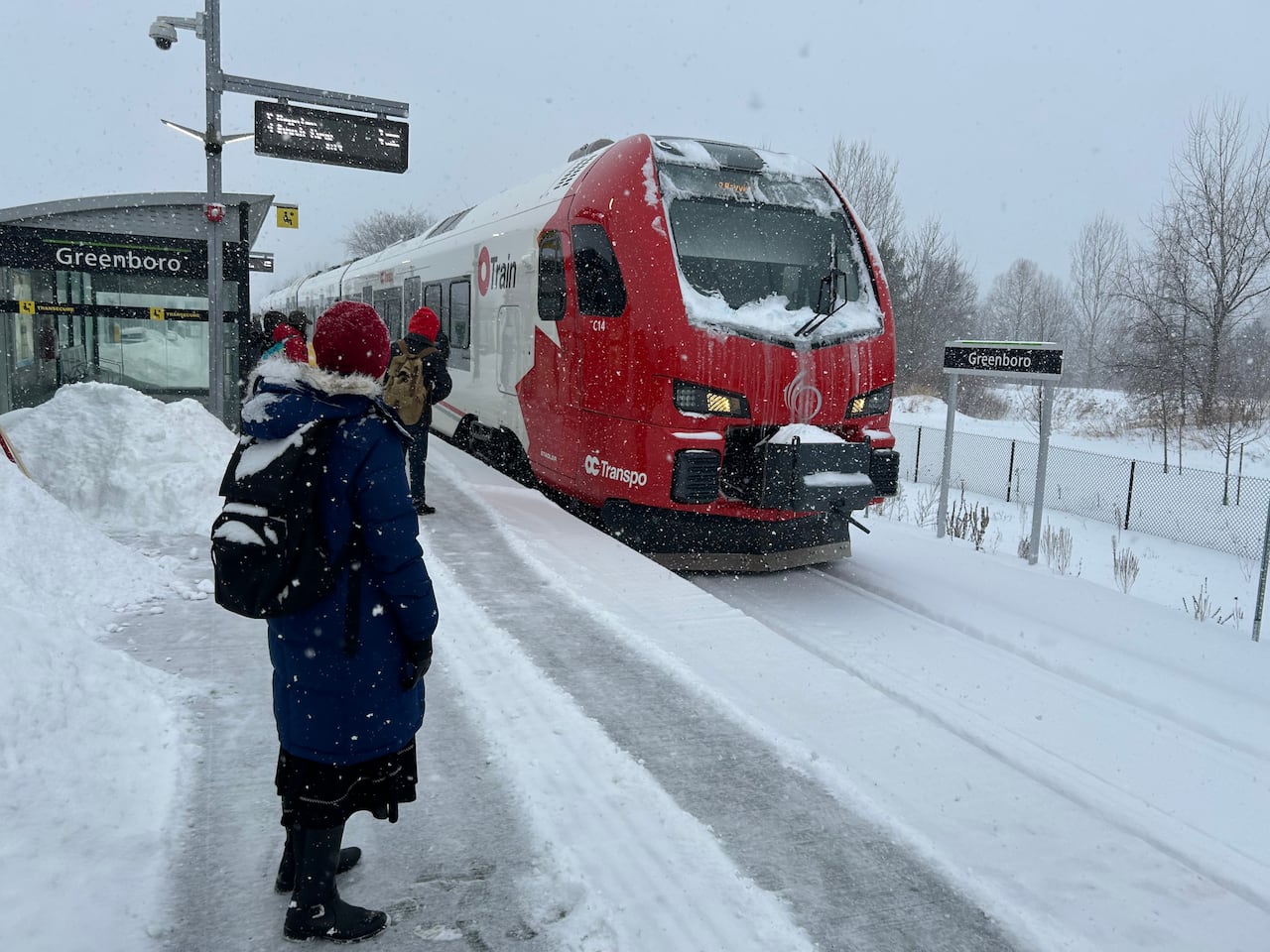 A train arrives at Greenboro station in the snow