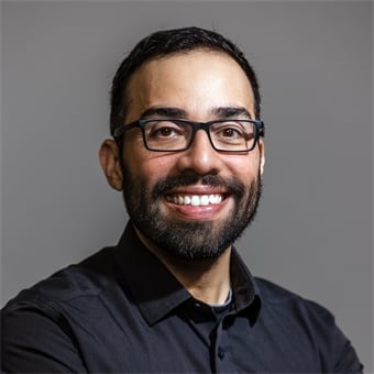 a man smiles at the camera