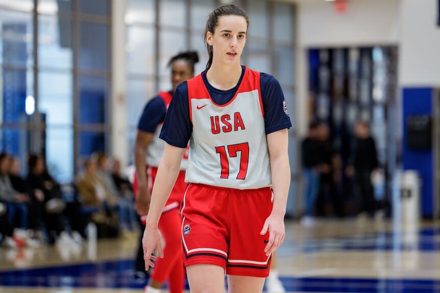 Caitlin Clark practices in a red USA uniform.