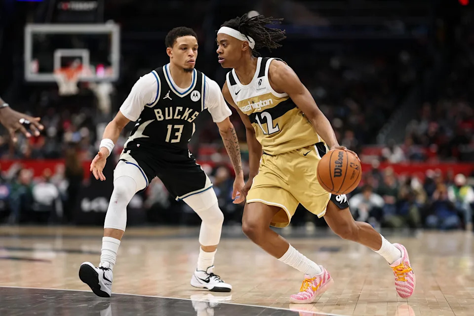 WASHINGTON, DC - JANUARY 29: Tre Johnson #12 of the Washington Wizards goes to the basket against Ryan Rollins #13 of the Milwaukee Bucks during the first half at Capital One Arena on January 29, 2026 in Washington, DC. NOTE TO USER: User expressly acknowledges and agrees that, by downloading and or using this photograph, User is consenting to the terms and conditions of the Getty Images License Agreement. (Photo by Scott Taetsch/Getty Images)