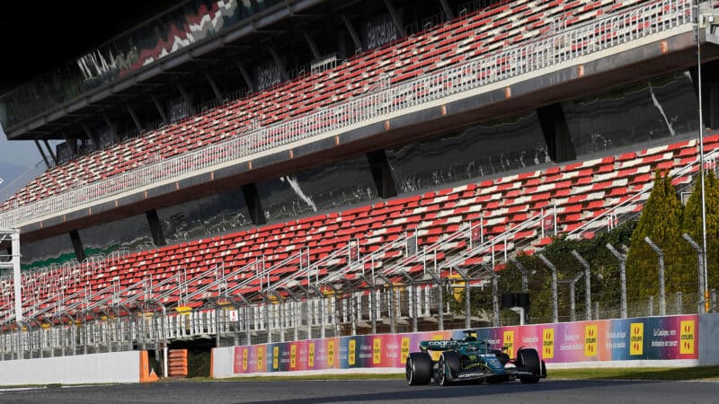 Lance Stroll (Aston Martin-Mercedes) and empty grandstands during 2022 pre-season test at the Circuit de Barcelona Catalunya