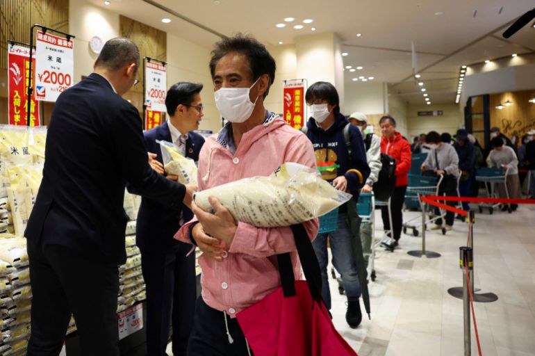 People stand in line as they buy government-stockpiled rice aiming at resolving persisting price rises sold at Ito-Yokado grocery store, a subsidiary of Seven & i Holdings, in Tokyo, Japan May 31, 2025. REUTERS/Issei Kato