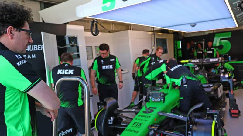 Mattia Binotto watches Gabriel Bortoleto in the pits before the 2025 Australian Grand Prix