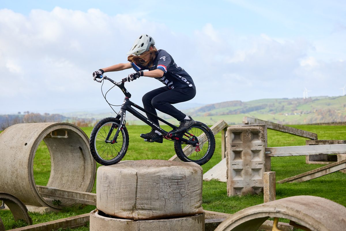 Daisy Craig riding MTB trials in an MBUK photo shoot