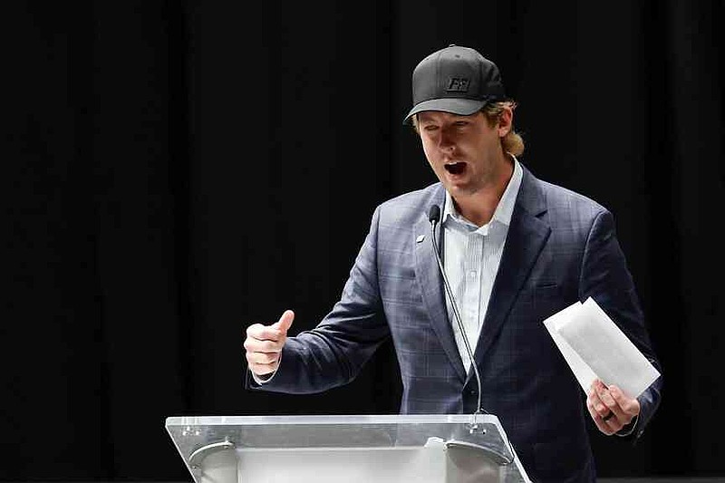 Garrett Mitchell speaks at the memorial service for former NASCAR driver Greg Biffle and his family in Charlotte, N.C., Friday, Jan. 16, 2026. (AP Photo/Nell Redmond)