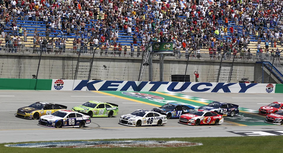 Dale Earnhardt Jr., 88, and Carl Edwards, 99, lead the pack to start the NASCAR Sprint Cup Series race, the Quaker State 400, at the Kentucky Speedway in Sparta, Kentucky Sunday June 30, 2013.