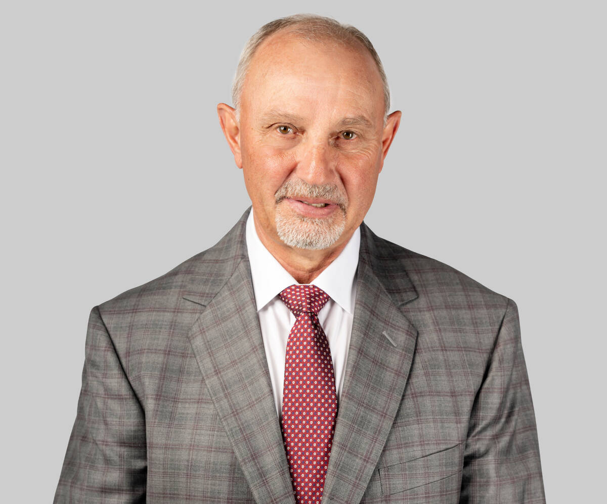 Former NHL player Brent Sutter wearing a suit and a tie.