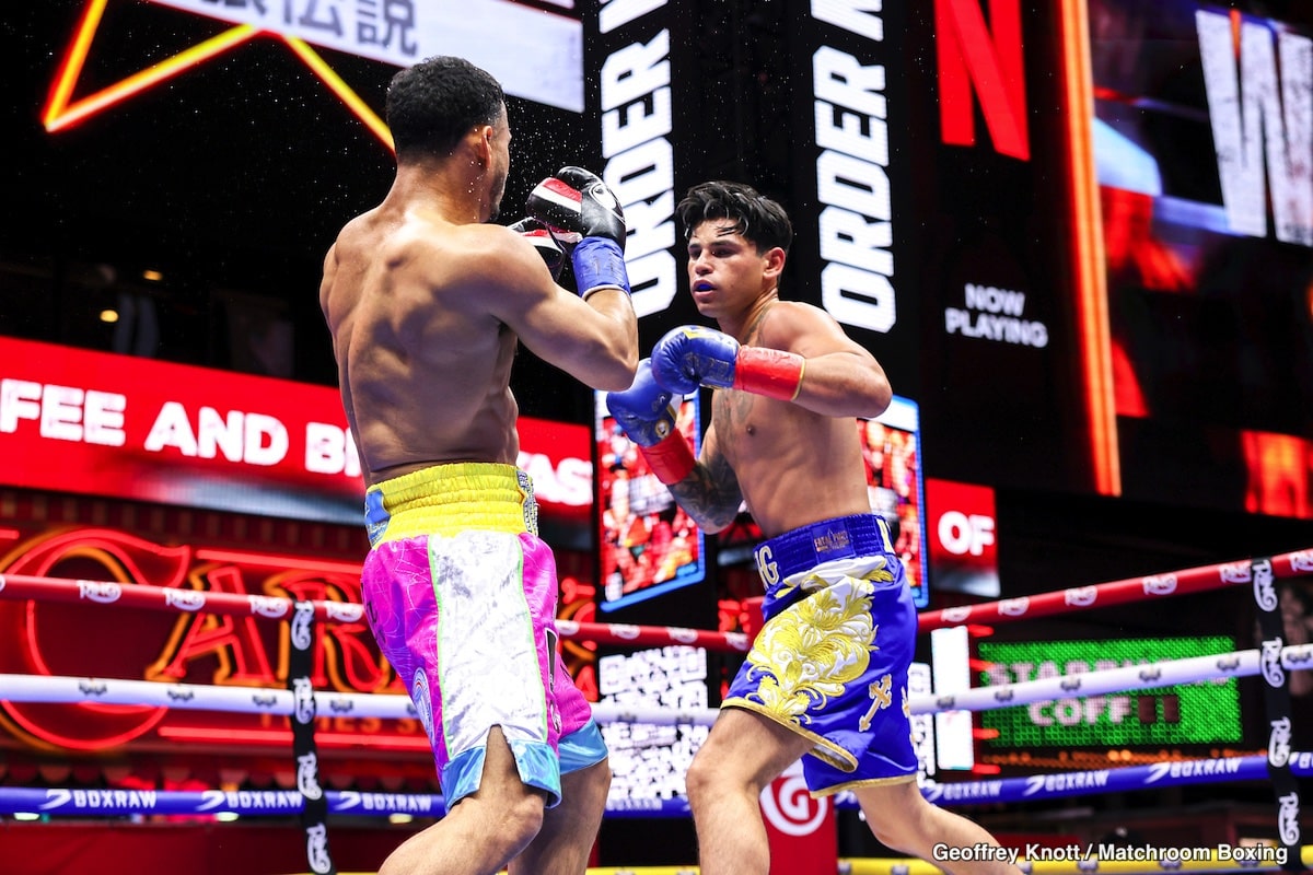 Ryan Garcia throws a right hand at Rolando “Rolly” Romero during their welterweight fight on May 2, 2025, at Times Square in New York City.