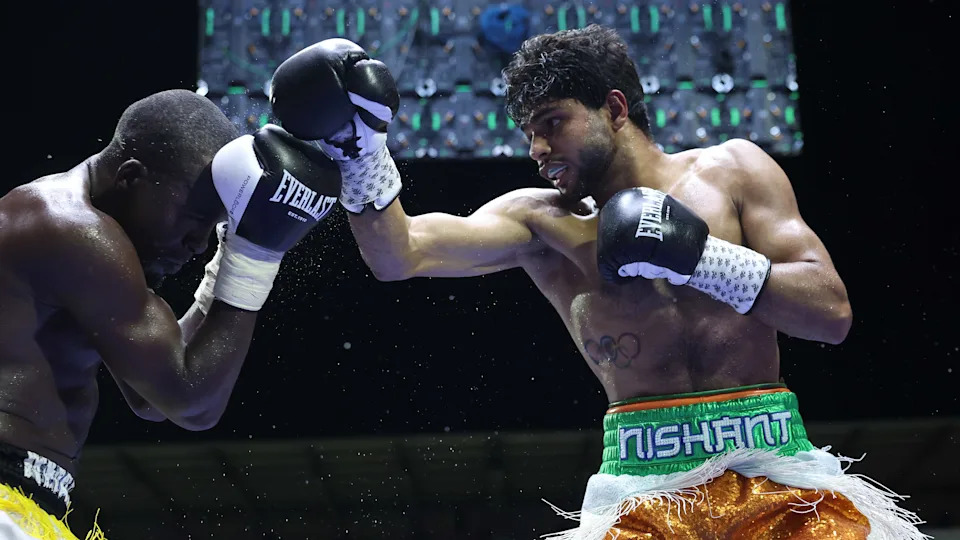 ACCRA, GHANA - DECEMBER 20: Nishant Dev (orange/white/green shorts) v Ally Mbukwa, Super Welterweight Contest on December 20, 2025 in Accra, Ghana.  (Photo by Mark Robinson/Getty Images).