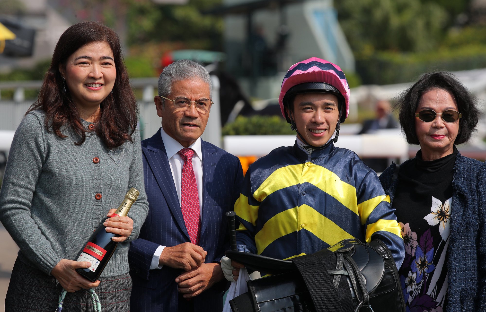 Trainer Tony Cruz (second from left), jockey Angus Chung and connections of Iron Legion after his win. Trainer Tony Cruz (second from left), jockey Angus Chung and connections of Iron Legion after his win.