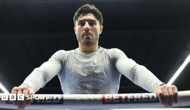 Josh Kelly leans over the ropes