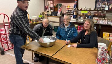 Cliff Jordhal draws a name for the Castor Elks as Elks members Pat Annette, George Nichols, and Jackie Baldwin look on. (Lynn Sabo photo)