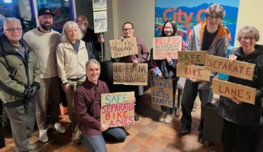 Bike lane lobbyists brought signs to city hall to speak with council about the Lougheed Transit Corridor Area Plan. (Special to The News)