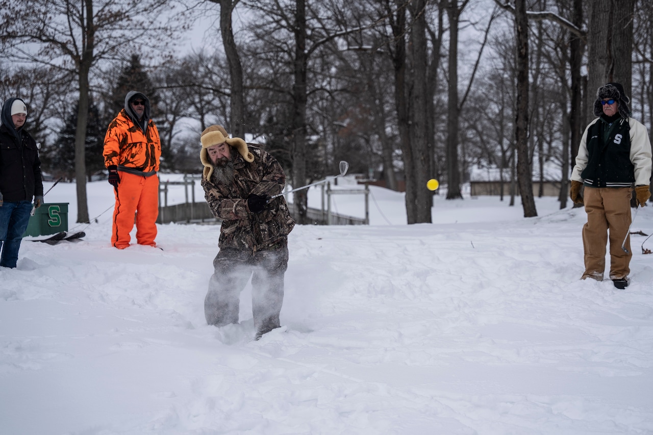 Golfers play through the snow at the annual Kiwanis Chili Golf Classic