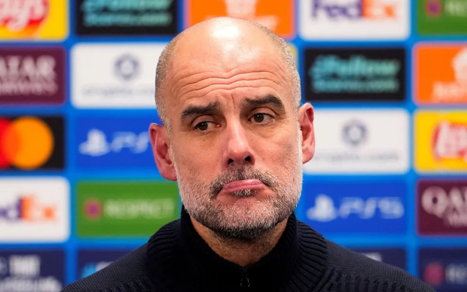 Manchester City manager Pep Guardiola looks dejected during a press conference