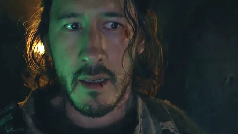 Mark Fischbach as the lead character with a look of concern on his face in Iron Lung
