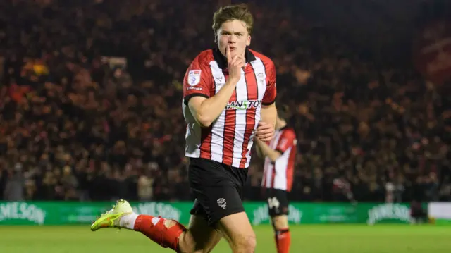 Freddie Draper celebrates scoring for Lincoln against Bradford