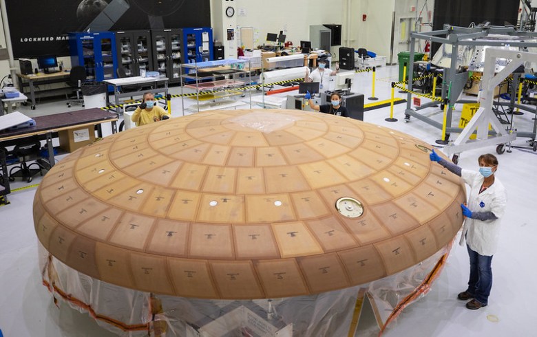 Inside the Neil Armstrong Operations and Checkout Building high bay at NASA's Kennedy Space Center in Florida, from left, technicians Kenny Leidner, Diamond ScharSenstine, Russ Novak and Darlene Beville with ASRC Federal, inspect AVCOAT block bonding on the Artemis II heat shield on July 2, 2020. Credit: NASA/Isaac Watson