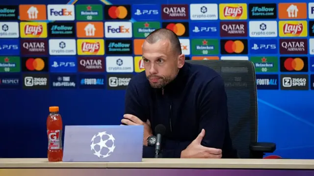 John Heitinga during a news conference.