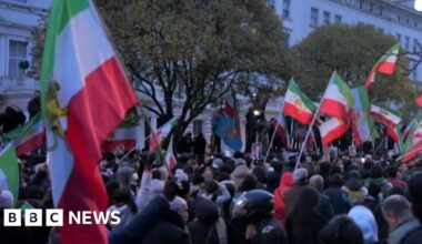 Protester climbs on to balcony of Iranian embassy in London